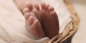 Baby feet representing postnatal massage