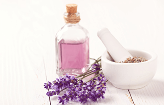 lavender oil and mortar with fresh lavender